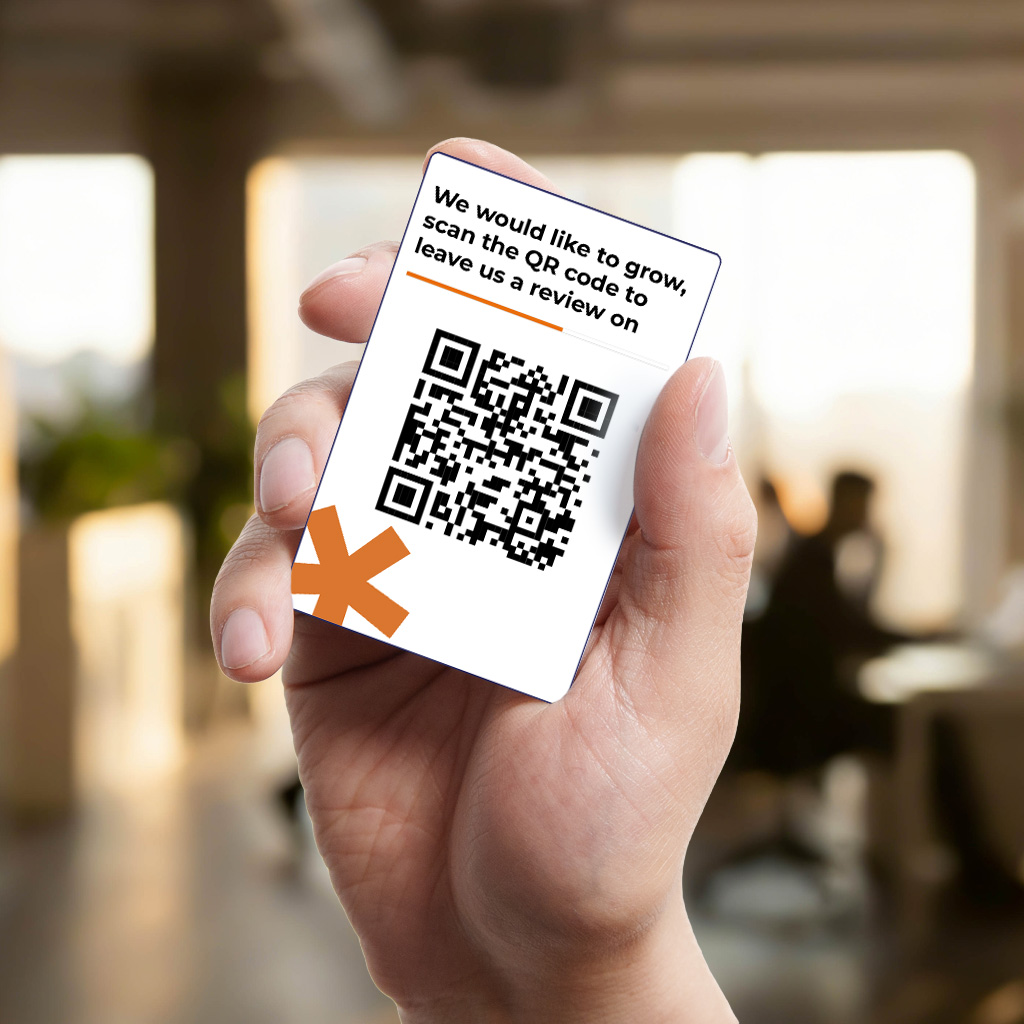 QR review business card in a hand